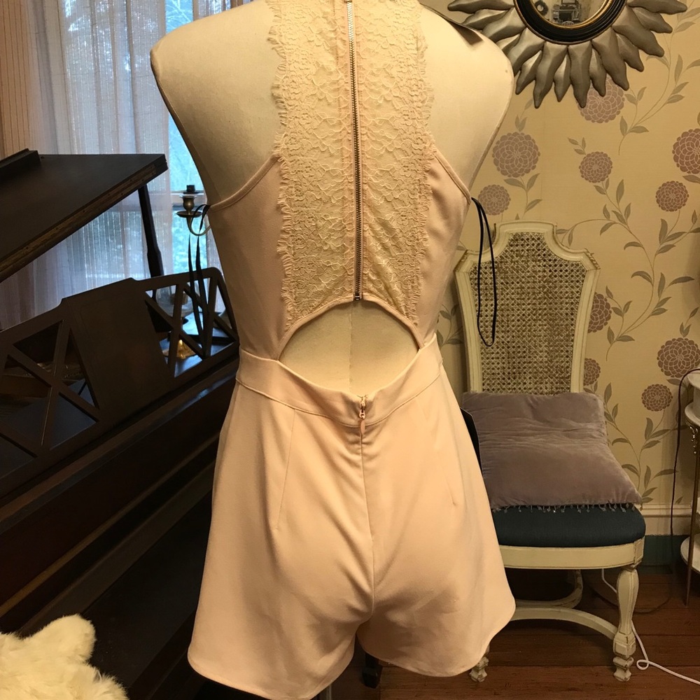 NWT Bebe shorts romper. Size 6 retails 108